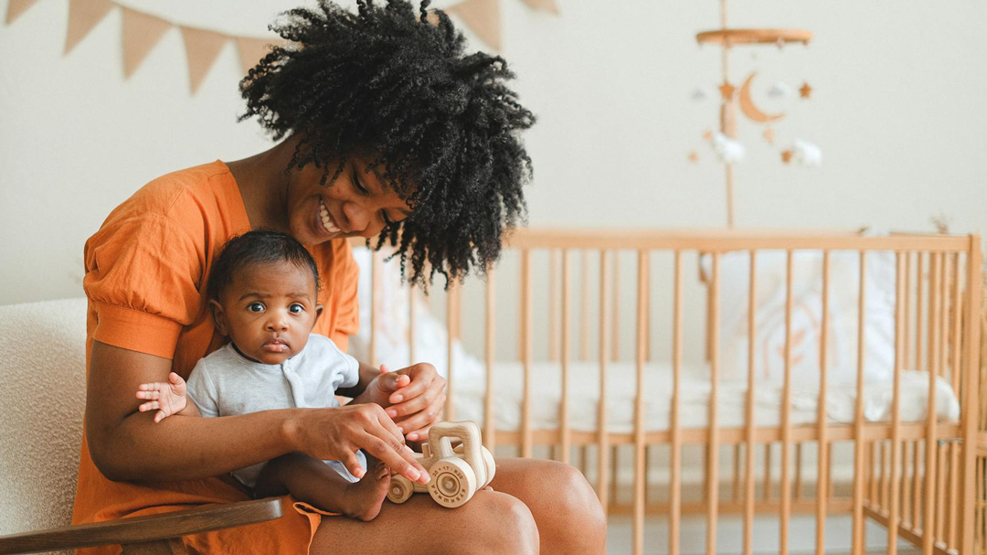 A woman holding a baby